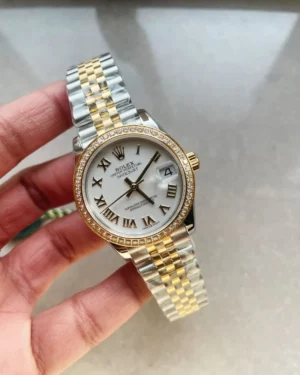 Rolex Datejust 31mm 278273 with a white dial, diamond bezel Rolex Datejust 31mm 278273 with a white dial, diamond bezel, and YG/SS Jubilee bracelet.