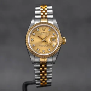 Rolex Datejust 26mm with a Two-Tone Yellow Gold finish and Champagne Diamond Dial.