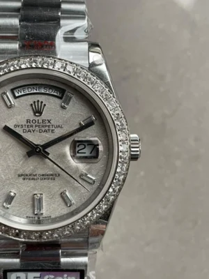 Rolex Day-Date 40mm 228349 with a meteorite dial, diamond bezel, diamond hour markers, and stainless steel President bracelet.