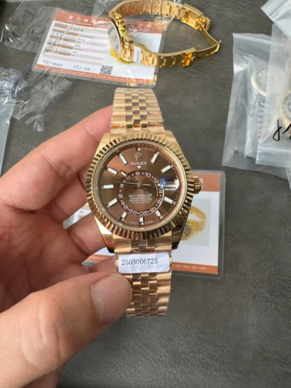 Noob Factory Rolex Sky-Dweller Super Clone with a 42mm case, fluted Ring Command bezel, Oyster bracelet, and automatic movement.