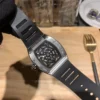Richard Mille RM 19 Replica Watch 2 Richard Mille RM 19 replica watch with a skeletonized dial, tonneau-shaped case, mechanical movement, sapphire crystal, and black rubber strap.
