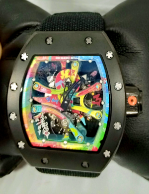 Richard Mille RM 68-01 replica watch with a skeletonized artistic dial, tonneau-shaped case, mechanical movement, sapphire crystal, and black rubber strap.