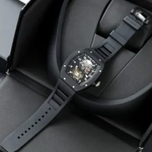 Richard Mille RM001 Tourbillon Black Ceramic 42mm watch with a skeletonized dial, black ceramic tonneau case, manual-winding movement, and black rubber strap.