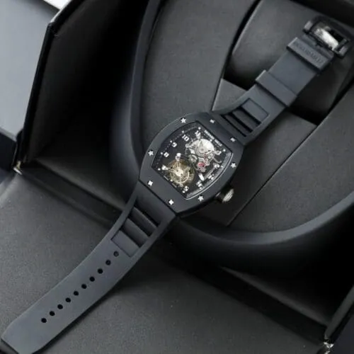 Richard Mille RM001 Tourbillon Black Ceramic 42mm watch with a skeletonized dial, black ceramic tonneau case, manual-winding movement, and black rubber strap.