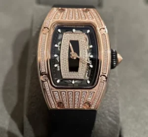 Richard Mille RM007-1 replica watch with a tonneau-shaped case, automatic movement, skeleton-inspired dial, sapphire crystal, and black rubber strap.