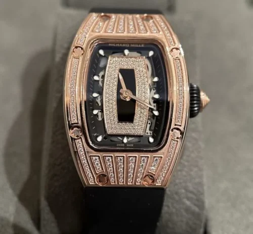 Richard Mille RM007-1 replica watch with a tonneau-shaped case, automatic movement, skeleton-inspired dial, sapphire crystal, and black rubber strap.