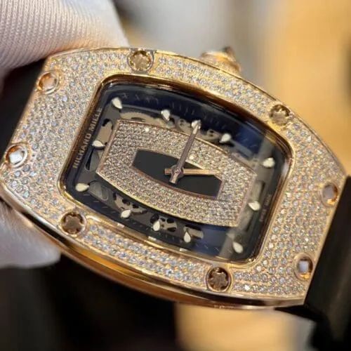 Richard Mille RM007 Gold Wrapped Watch with Moissanite Diamonds 36mm featuring a gold tonneau-shaped case, skeleton-inspired dial, automatic movement, and premium rubber strap.