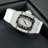 Richard Mille RM007 White Custom Full Moissanite Diamonds watch with a white tonneau-shaped case, skeleton-inspired dial, automatic movement, and white rubber strap.