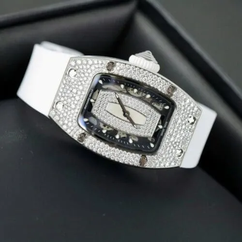 Richard Mille RM007 White Custom Full Moissanite Diamonds watch with a white tonneau-shaped case, skeleton-inspired dial, automatic movement, and white rubber strap.