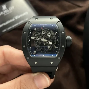 Richard Mille RM055 Black Ceramic Rubber Strap BBR Factory 50mm Richard Mille RM055 Black Ceramic Rubber Strap BBR Factory 50mm watch with a black ceramic-style tonneau case, skeletonized dial, sapphire crystal, and black rubber strap.