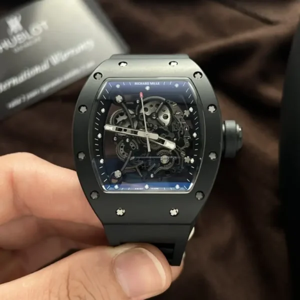 Richard Mille RM055 Black Ceramic Rubber Strap BBR Factory 50mm watch with a black ceramic-style tonneau case, skeletonized dial, sapphire crystal, and black rubber strap.