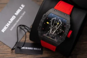 Richard Mille RM27-03 Tourbillon Rafael Nadal Carbon 44mm watch with a skeletonized dial, carbon tonneau case, manual-winding movement, and black rubber strap.
