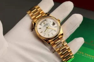 Rolex Day-Date 36mm Super Clone with a Mother of Pearl dial, Custom Gold Wrapped finish, and President bracelet.