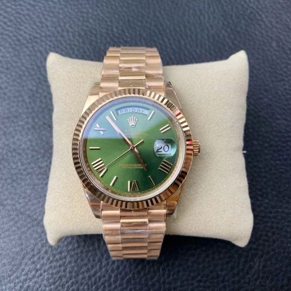 Rolex Day-Date 40 Yellow Gold Green Roman Dial 228238 Super Clone Rolex Day-Date 40 reference 228238 Super Clone with a Yellow Gold finish, Green Roman dial, and President bracelet.