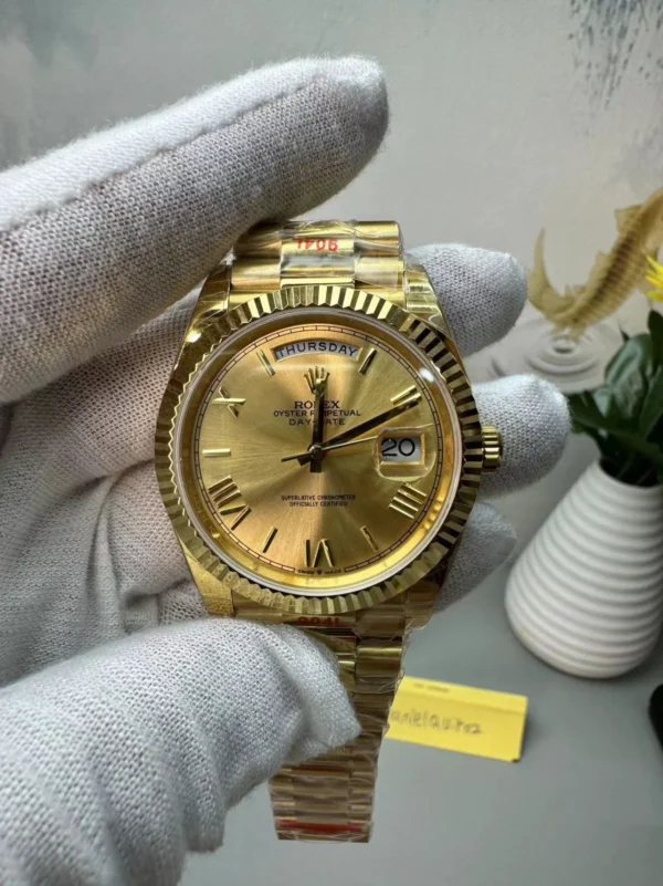 Rolex Daydate Presidential Gold Dial Roman Numerals Weighted Version CDB Super Clone Rolex Day-Date Presidential Super Clone with a gold dial, Roman numeral hour markers, weighted construction, and President bracelet.