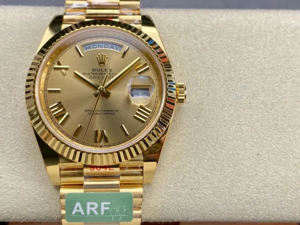 Rolex Day-Date Presidential Super Clone with a gold dial, Roman numeral hour markers, weighted construction, and President bracelet.
