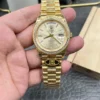 Rolex Oyster Perpetual Day-Date Super Clone with a yellow gold finish, champagne dial, and President bracelet weighing approximately 210g.