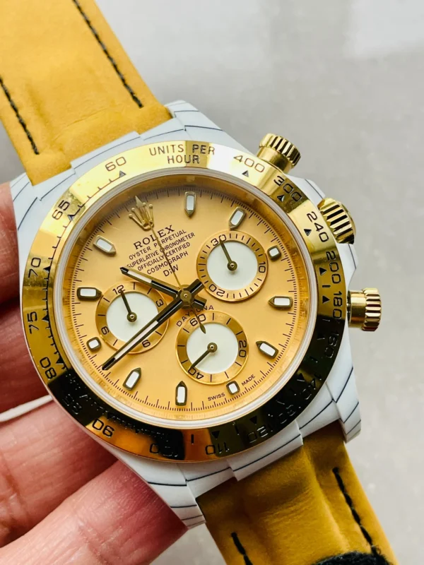 2aacbfba-1f31-4af5-8c64-f56d2cb089d6-1 Rolex Daytona DIW White Carbon Gold Dial A7750 Super Clone featuring a 40mm white carbon fiber case, Gold Dial, black nylon strap, tachymeter bezel, and A7750 automatic chronograph movement.