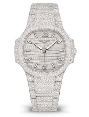 7118_1450G_001_001 Patek Philippe Nautilus 7118/1450G with a white gold case, diamond-set dial, and matching bracelet.