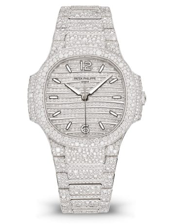 Patek Philippe Nautilus 7118/1450G with a white gold case, diamond-set dial, and matching bracelet.