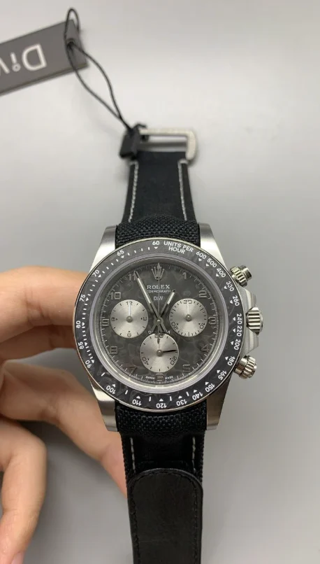 DIW Rolex Daytona DIW Rolex Daytona featuring a 40mm carbon case, DIW dial, strap, fixed tachymeter bezel, and automatic chronograph movement.
