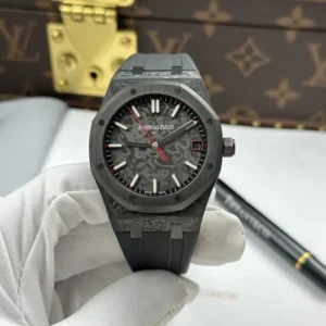 Audemars Piguet Royal Oak DiW 15500 with a 41 mm carbon case and red seconds hand.