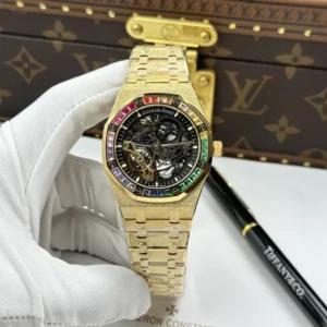 Audemars Piguet Royal Oak Openworked 15412 with a Yellow Gold frosted case, Skeleton Dial, Baguette Stone Bezel, and 41mm case.
