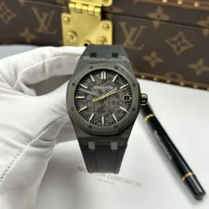 Audemars Piguet Royal Oak DiW 15500 with a 41 mm carbon case and yellow seconds hand.