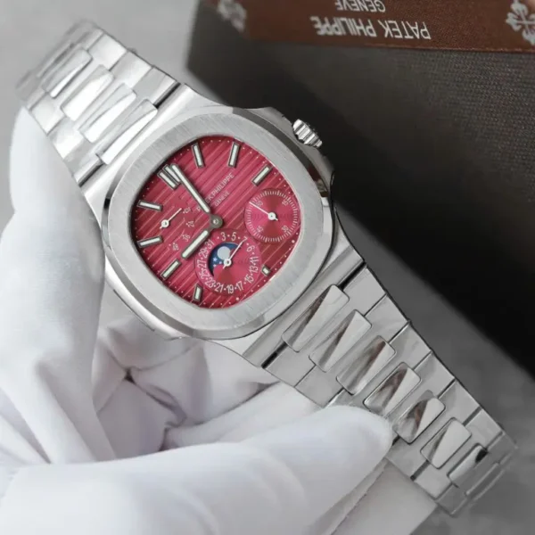 Patek Philippe Nautilus 5712 GR Factory with a Cherry Dial, Metal Strap, and 40mm case