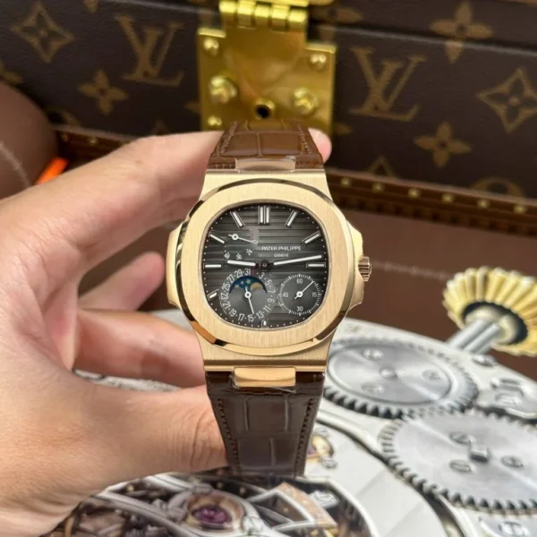 Patek Philippe Nautilus 5712R with a Gray Dial, Leather Strap, Engraving Machine detailing, and 40mm case.