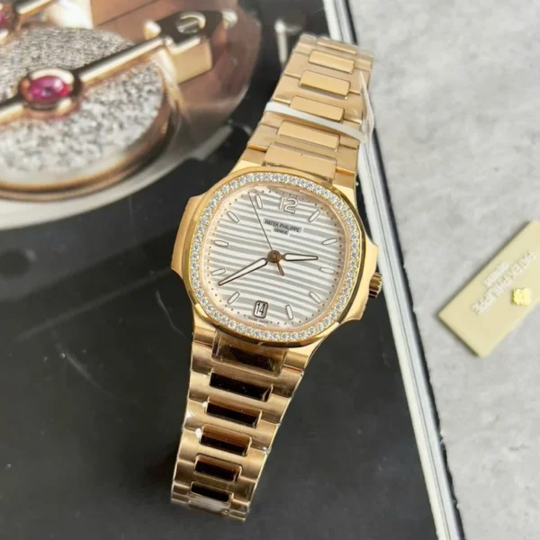 Patek Philippe Nautilus 7118 with a White Dial, Moissanite Diamonds Bezel, and 35.2mm case.