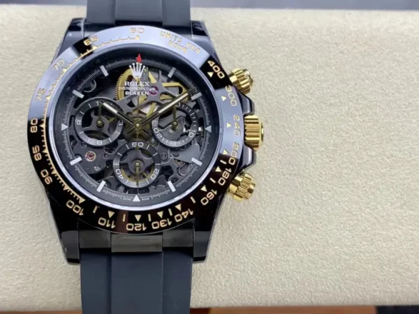Dong-Ho-Rolex-Daytona-By-Blaken-Replica-11-Mau-Den-Mat-Lo-Co-40mm-1-768x576.jpg Rolex Daytona Blaken Skeleton Dial Rubber Strap 40mm Super Clone featuring a black case, Skeleton Dial, black rubber strap, fixed tachymeter bezel, and Clone Rolex 4130 automatic chronograph movement.