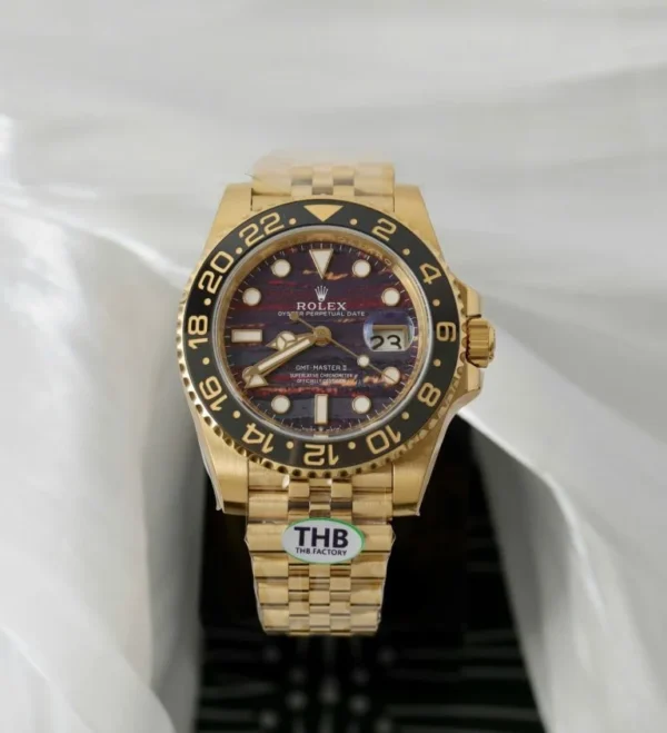 Rolex GMT-Master II 126718 GRNR THBF Super Clone with a 40mm yellow gold-tone case, Grey and Black Cerachrom bezel, Black Dial, Oyster bracelet, and Clone Rolex 3285 automatic movement.
