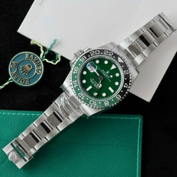 Rolex GMT-Master II 126729 VTNR THBF Super Clone with a 40mm stainless steel case, Green Dial, green and black Cerachrom bezel, Oyster bracelet, and Clone 3285 automatic movement. Rolex GMT-Master II 126729 VTNR THBF Super Clone with a 40mm stainless steel case, Green Dial, green and black Cerachrom bezel, Oyster bracelet, and Clone 3285 automatic movement.