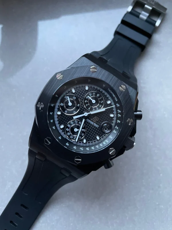 IMG-20230524-WA0112-1 Audemars Piguet Royal Oak Offshore Chronograph with a black dial, ceramic case, and black rubber strap.