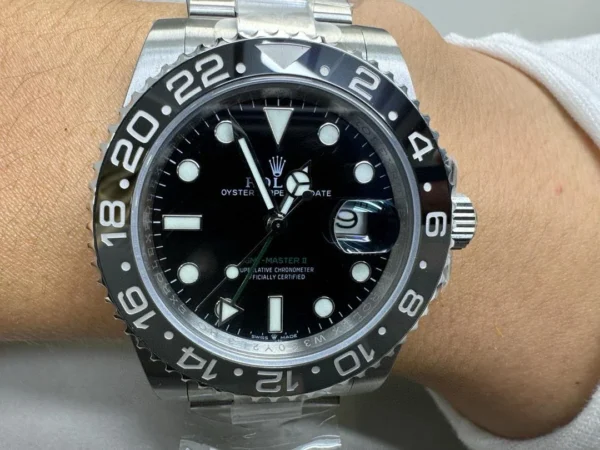 Rolex GMT-Master II Bruce Wayne 126710GRNR Super Clone with a Black Dial, Black and Grey Cerachrom bezel, Oyster bracelet, and Clone Rolex 3285 automatic movement.