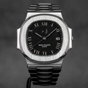 Patek Philippe Nautilus 3710/1A-001 with a Comet Black Roman Dial and Roman numeral markers.