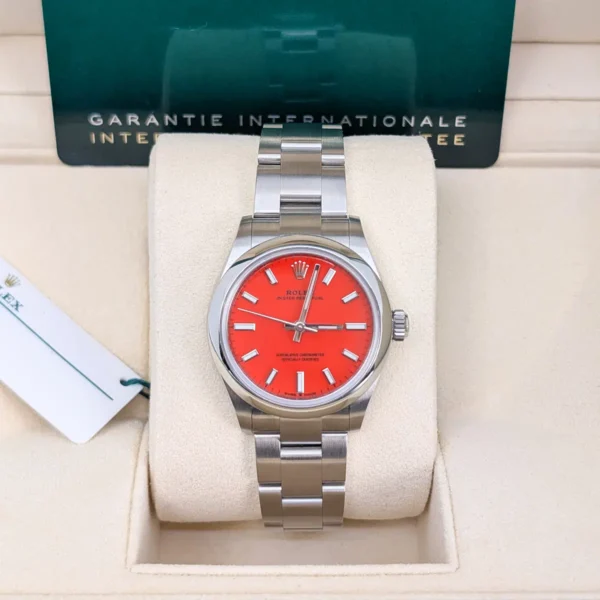 Rolex-277200-coral-red-1.jpg Oyster Perpetual 31mm 277200 DIWF Best Edition with a 31mm stainless steel case, smooth bezel, Oyster bracelet, and classic Oyster Perpetual styling