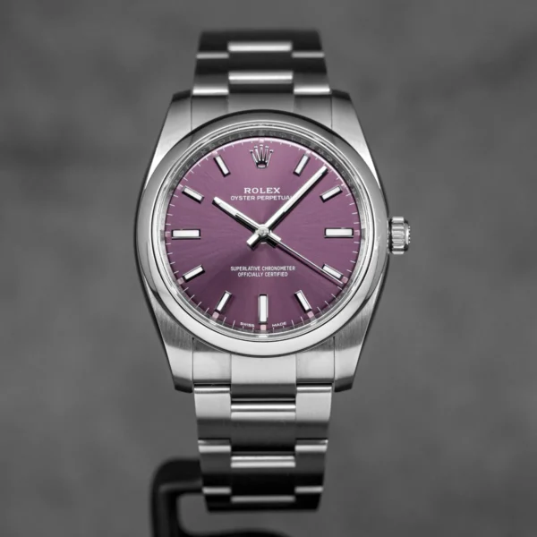 Rolex-Oyster-Perpetual-Indonesia-_1 Oyster Perpetual 34mm Red Grape Dial featuring a 34mm stainless steel case, Red Grape dial, smooth bezel, Oyster bracelet, and automatic movement.