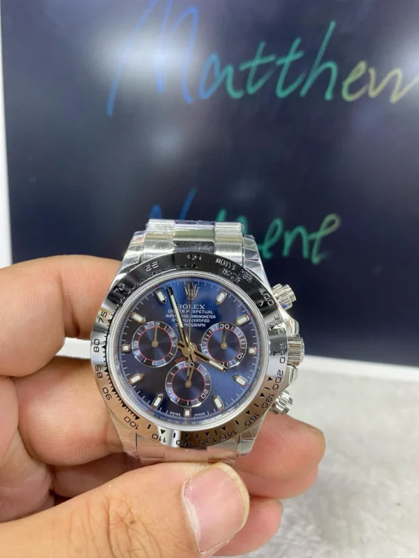 WhatsApp-Image-2025-06-08-at-11.03.56_0ea2d430 Rolex Daytona 126509 White Gold Blue Dial Super Clone featuring a 40mm white gold-tone case, Bright Blue Dial, fixed white gold tachymeter bezel, Oyster bracelet, and 4131 Super Clone automatic chronograph movement.