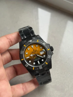 WhatsApp-Image-2025-09-16-at-00.13.23-scaled-1 Rolex Submariner DIW DLC Super Clone featuring a Black & Orange Dial, 904L DLC-coated stainless steel case, black ceramic bezel, DLC Oyster bracelet, sapphire crystal, and VS3135 automatic movement.