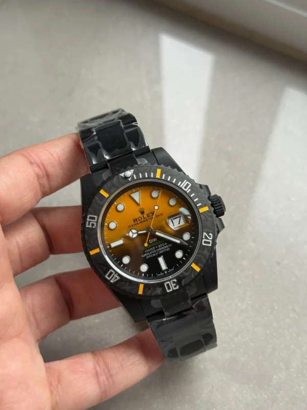 Rolex Submariner DIW DLC Super Clone featuring a Black & Orange Dial, 904L DLC-coated stainless steel case, black ceramic bezel, DLC Oyster bracelet, sapphire crystal, and VS3135 automatic movement.