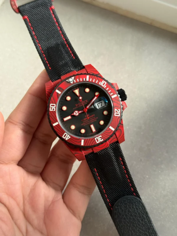 Rolex Submariner DIW Red Carbon Super Clone featuring a red forged carbon case, Black Dial, black ceramic bezel, black nylon strap, sapphire crystal, and VS3135 automatic movement.
