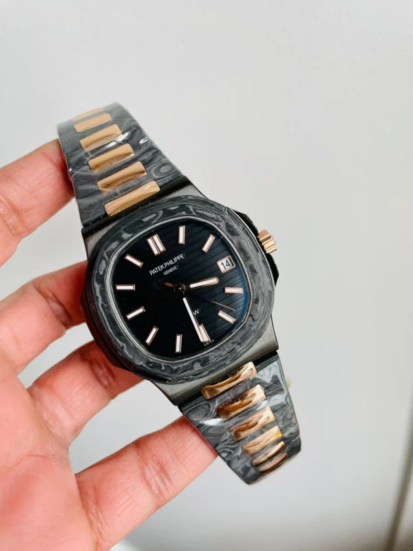 Patek Philippe Nautilus 5711 DIWF 1:1 Best Edition with a Black Textured Dial, Carbon/RG Bracelet, and 324CS movement.