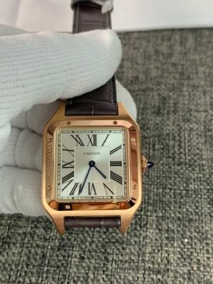 Cartier De Santos-Dumont W2SA0011 Cartier Santos Dumont Large 31 W2SA0011 Rose Gold-inspired watch with a silver Roman numeral dial, square two-tone case, and black leather strap