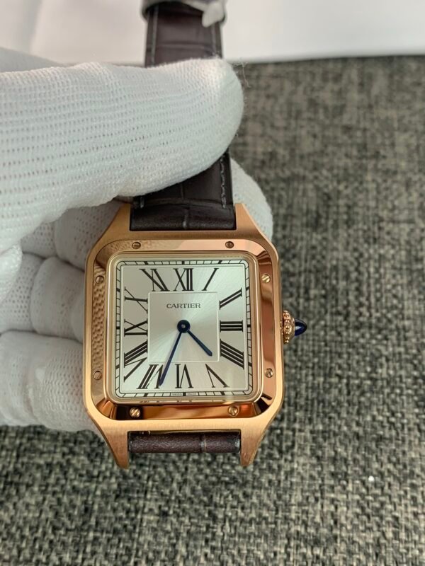 Cartier De Santos-Dumont W2SA0011 Cartier Santos Dumont Large 31 W2SA0011 Rose Gold-inspired watch with a silver Roman numeral dial, square two-tone case, and black leather strap