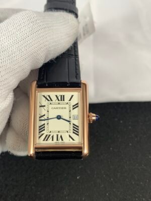 Cartier Tank Louis W1529756 Rose Gold Tank Must Large-inspired men's watch with white Roman numeral dial, rectangular stainless steel case, and black leather strap