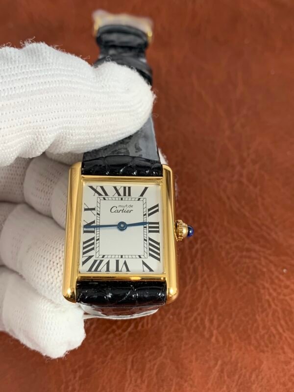Cartier Tank W5200002 Cartier Tank Must Large-inspired men's watch with white Roman numeral dial, rectangular stainless steel case, and black leather strap