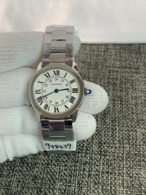 Rotonde WSRN0012-inspired men's watch with white Roman numeral dial, pink-gold-color round case, and brown leather strap